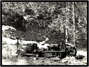 International Trucks Collectible Metal Sign: Vintage Well Drilling Flat Bed Outfit